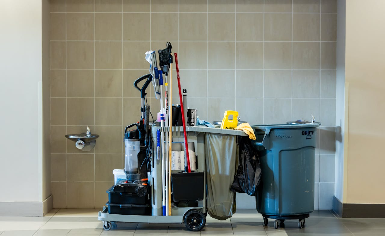 home-hero A comprehensive collection of professional cleaning tools on a cart in an indoor environment.